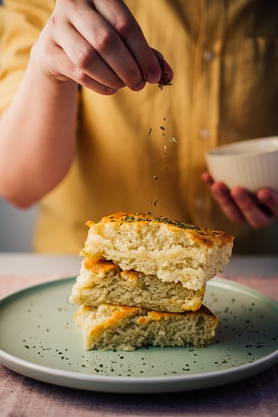 With a white ceramic bowl and bread
